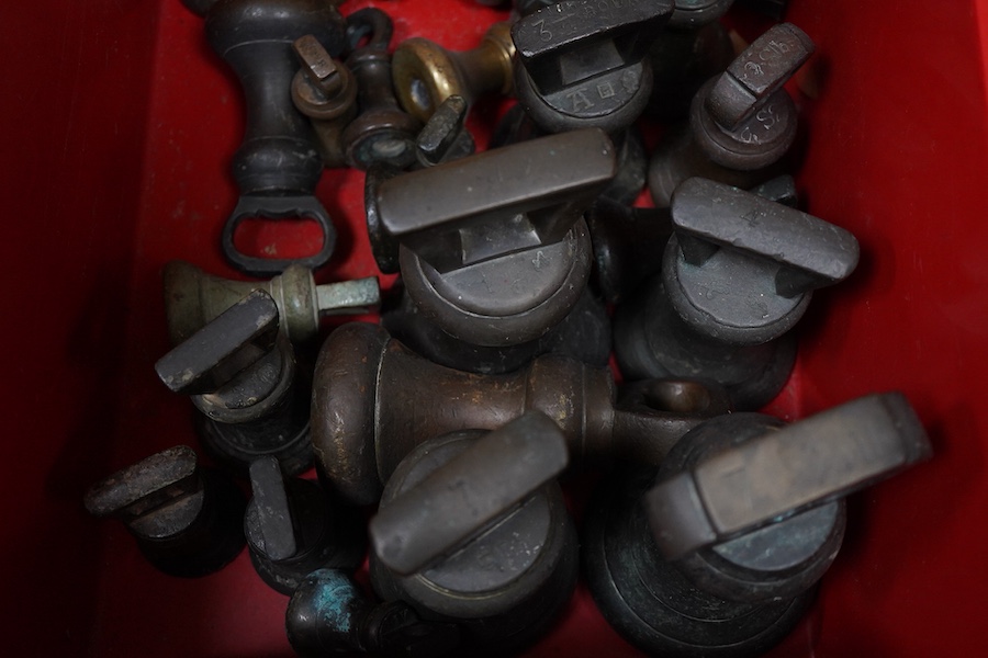 Twenty-four Georgian and later bronze bell weights, largest 7lb, some with Royal Cyphers for George IV, William IV, etc., weight marks, and other proof marks, etc.